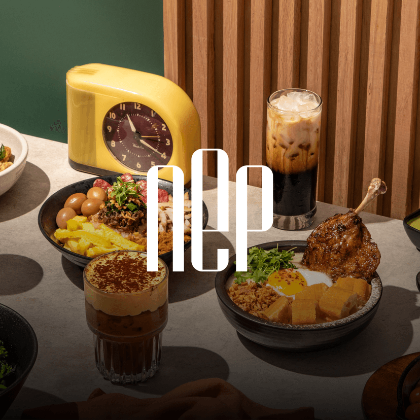 NEP Cafe logo overlaid on an overhead spread of Vietnamese-inspired dishes and drinks featuring banh mi chao with a sunny-side egg, beef tongue fried rice, egg coffee, ube coffee and other signature plates arranged on a modern table setting.